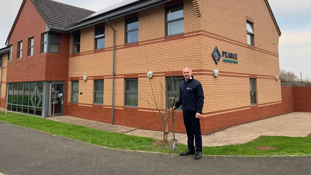 Pearce Homes Managing Director Paul Knox Planting a tree outside of Pearce Homes Offices in Barnstaple