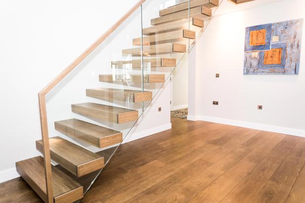 Bespoke wooden and glass staircase in luxurious new home in Saunton, Devon