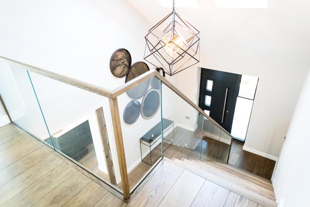 Bespoke wooden and glass staircase in luxurious new home in Saunton, Devon
