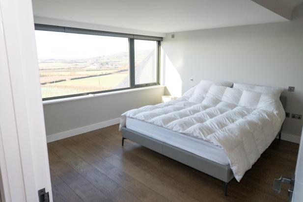 Bedroom with panoramic window view of Croyde