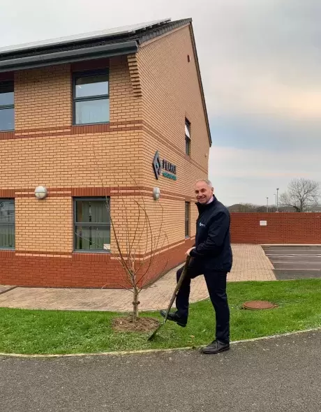 Pearce Homes Managing Director Paul Knox Planting a tree outside of Pearce Homes Offices in Barnstaple