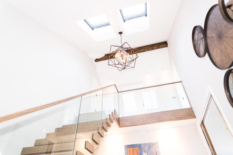 Bespoke wooden and glass staircase in luxurious new home in Saunton, Devon