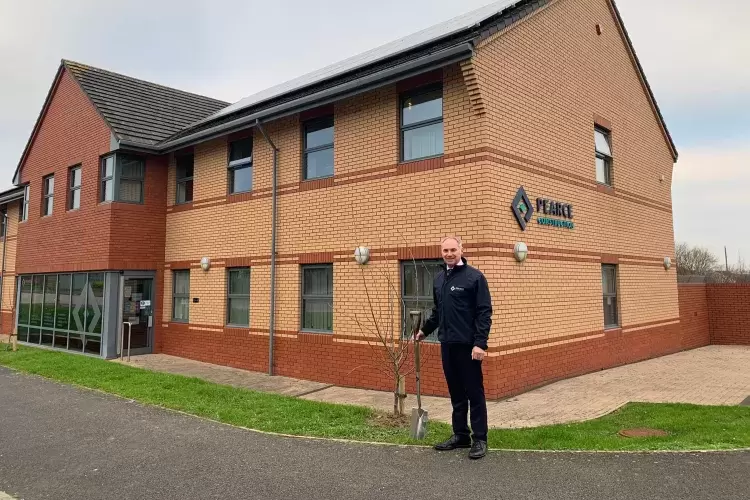 Pearce Homes Managing Director Paul Knox Planting a tree outside of Pearce Homes Offices in Barnstaple