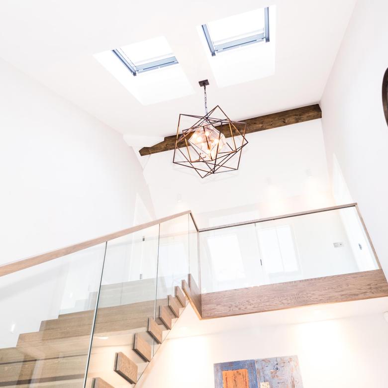 Bespoke wooden and glass staircase in luxurious new home in Saunton, Devon