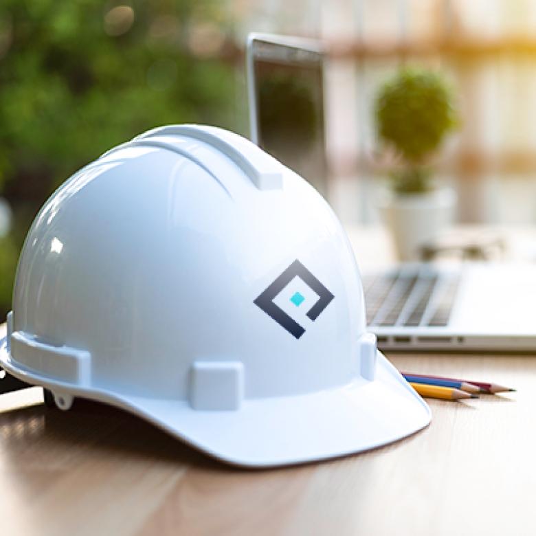 Construction Helmet with Pearce logo on it