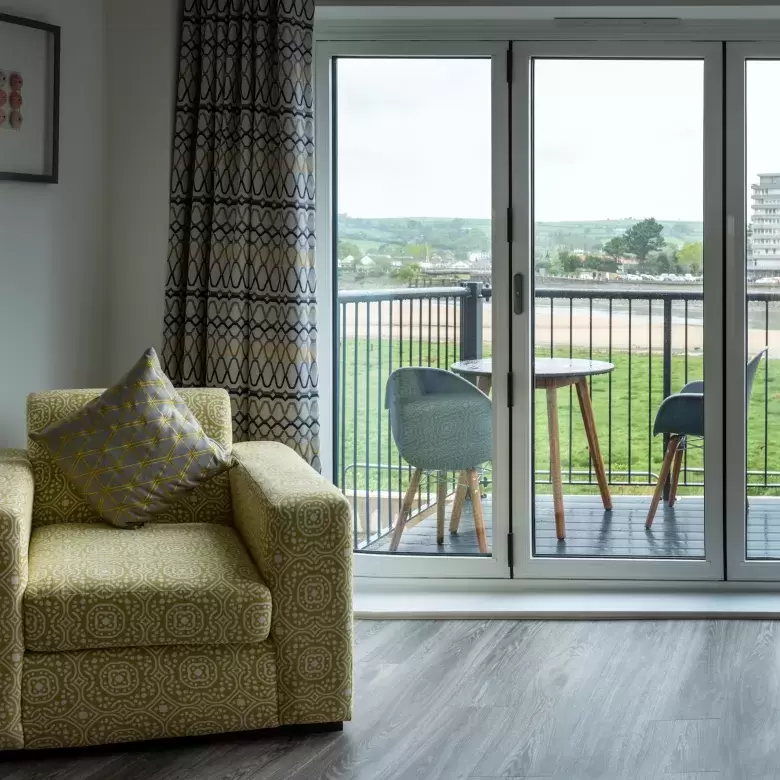 Living area of New Home with French Doors looking out to River Taw 